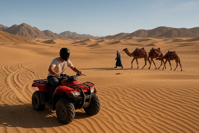 ATV rider and camel caravan crossing desert dunes